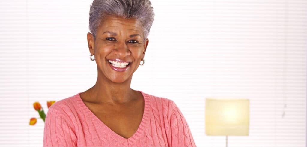 Smiling woman received dental crowns at Oak Hills Dentistry in Spring, TX