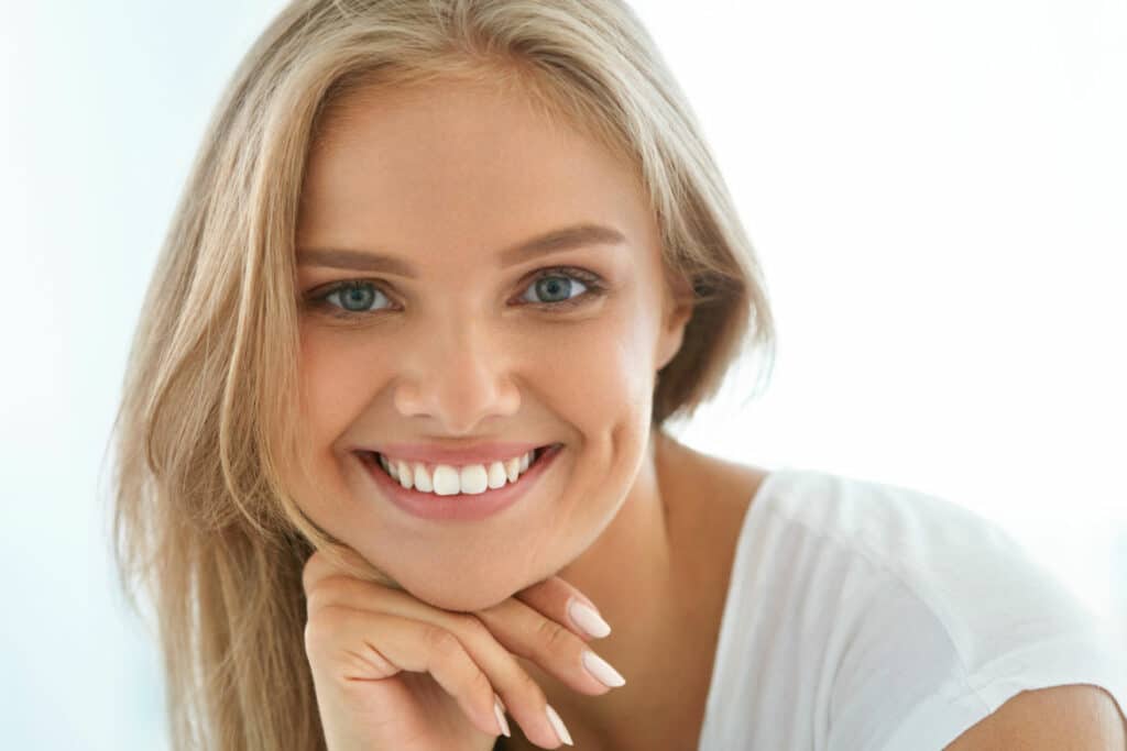 Attractive female smiling about periodontal care in Spring, TX