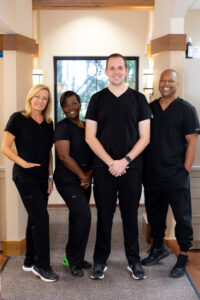 Oak Hills Dentistry team poses for a photo inside their Spring, TX dental practice